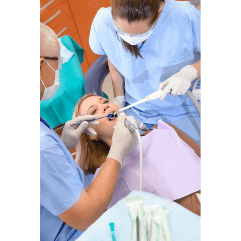 Dentist extracting patients wisdom tooth.